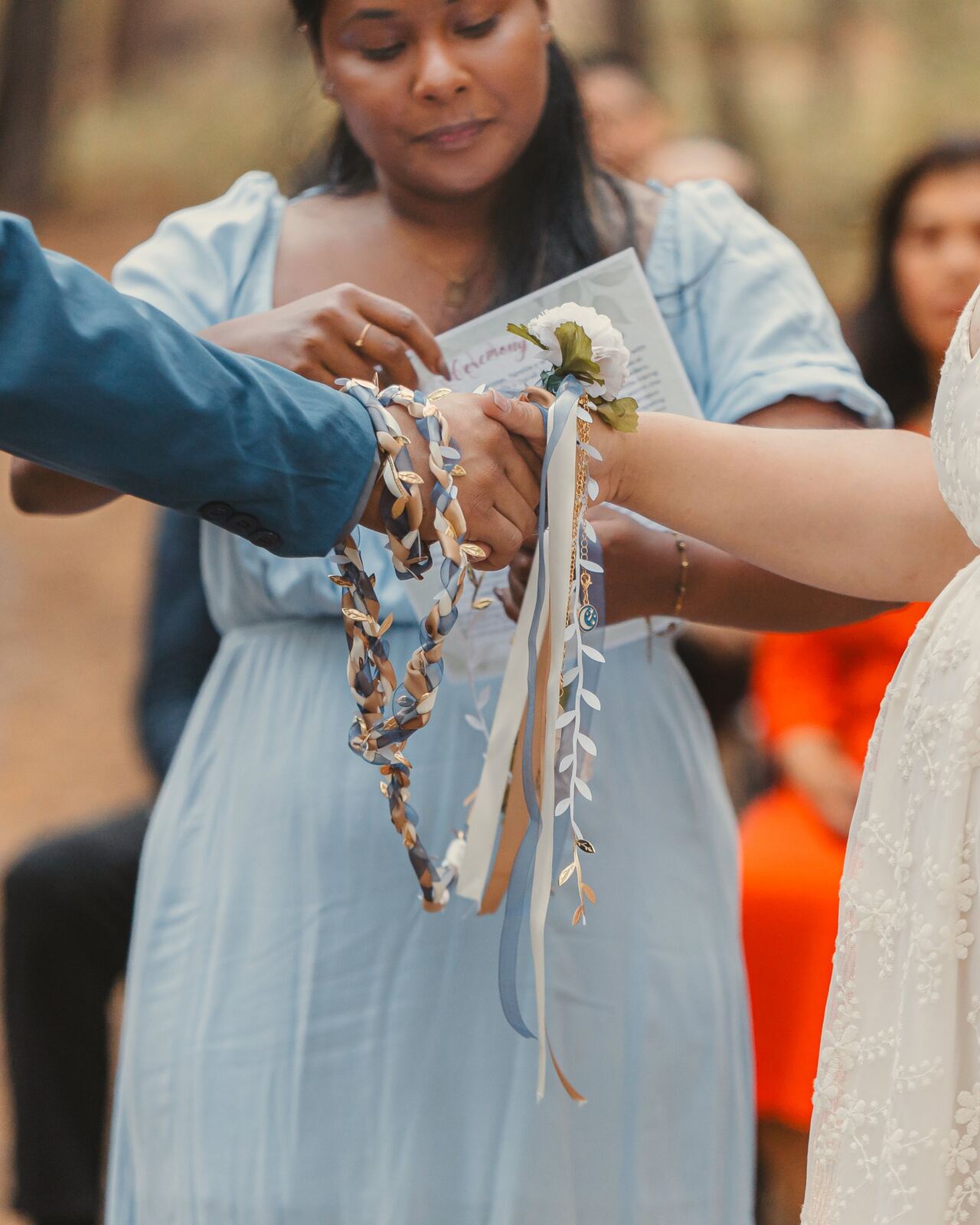 Andria performing the handfasting lazo ritual for Estella and Derek
